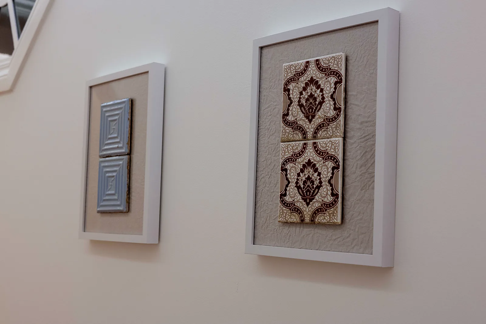 Framed tiles on the wall of the shared areas
